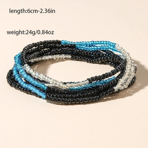 Detail shot of multi-layered beaded body chain with blue and black glass beads