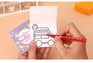 Detailed view of mini watercolor doodle book with ice cream car outline and red pen