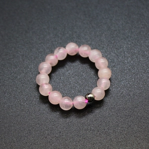 Adjustable 4mm pink natural stone beaded ring with a metallic bead on elastic cord