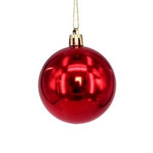 Glossy red Christmas ball ornament with golden cap and hanging string on white background