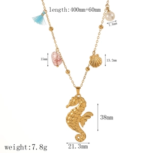 Golden ocean necklace with seahorse pendant, starfish, shells, and blue tassel for beach