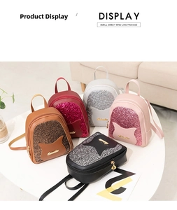 Mini sequin backpacks in five colors including silver and black on a white table
