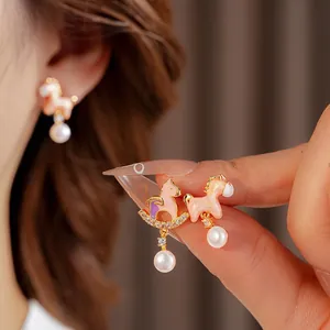 Exquisite horse-shaped pearl earrings with pink enamel and diamond accents for women