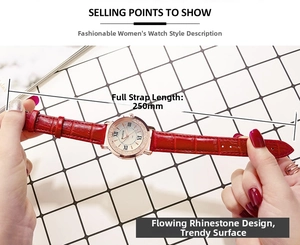 Detail of a gold watch with red leather strap and sparkling rhinestones on the dial