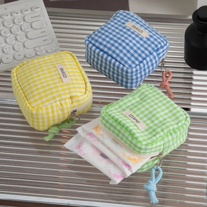 Three-piece set of checkered mini square cosmetic pouches with zipper and carry loops