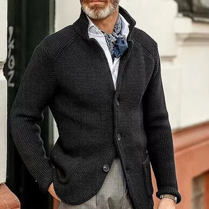 Detailed close-up of men's black knit cardigan featuring classic waffle knit texture