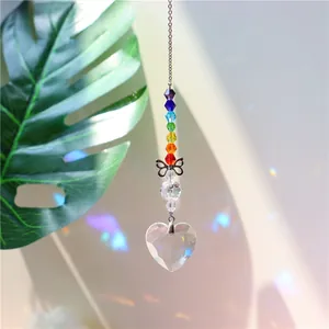Detail of crystal suncatcher featuring rainbow octagonal beads and a heart-shaped prism