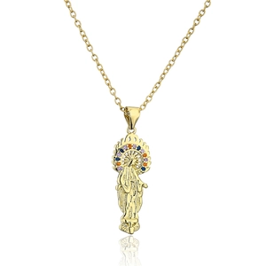 Detailed macro of gold plated Virgin Mary pendant with colorful pavé cubic zirconia