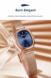 Close-up of elegant oval rose gold mesh watch with deep blue sunray dial and sleek finish