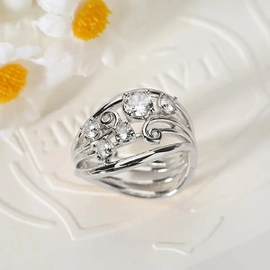 Detailed macro view of vintage vine leaves hollow ring with sparkling round zircon stone