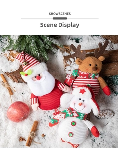 Three Christmas plush ornaments with Santa, elk, and snowman displayed in a snowy winter scene