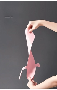 Close-up of flexible pink silicone toilet seat cover showing high elasticity and durability