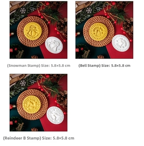 Close-up of circular Christmas cookie stamps featuring embossed snowman and reindeer designs