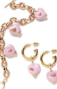 Detail of pink heart charms on gold-plated OT buckle bracelet and hoop earrings set