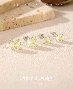 Detail of elegant S925 silver stud earrings featuring faceted yellow octagonal stones