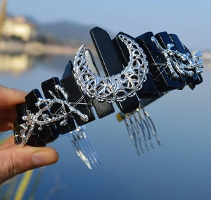 Detail of gothic crystal crown headband featuring black raw stones and silver crescent moon