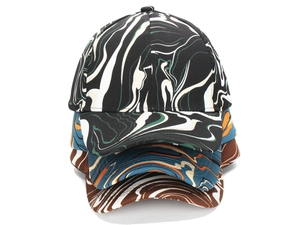 Detail of baseball cap featuring abstract fluid marble patterns and six-panel canvas crown