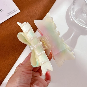 Iridescent acetate star bow hair claw clip with rhinestones for elegant styling