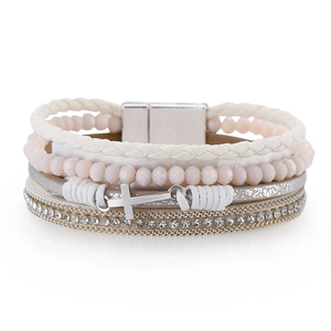 Detail of bohemian multilayer bracelet with pink crystal beads and silver cross pendant