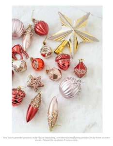 Festive Christmas ball set with red and gold ornaments on artificial snow background