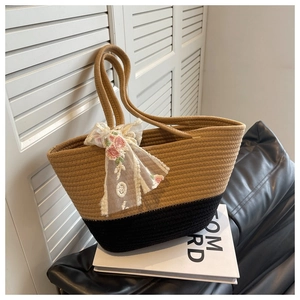 Detail of woven tote bag featuring floral lace ribbon and two-tone texture contrast