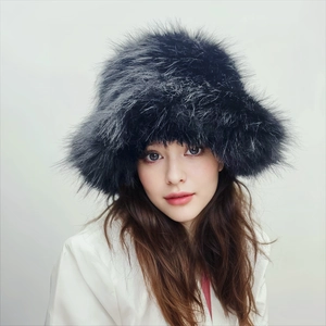 Detail shot of fluffy black faux fur bucket hat featuring long plush texture and warmth