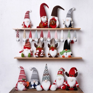 Collection of festive Christmas gnome plush decorations in red and grey holiday colors