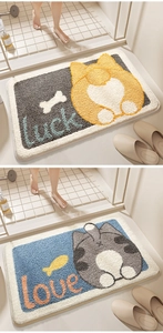 Close-up of thickened plush non-slip bathroom mats with cartoon cat and luck love motifs