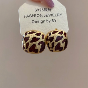 Detail of vintage square earrings featuring leopard print enamel and S925 silver posts