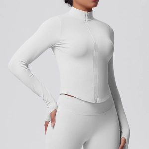 Detailed view of the thumb hole cuffs and ribbed texture on grey yoga jacket