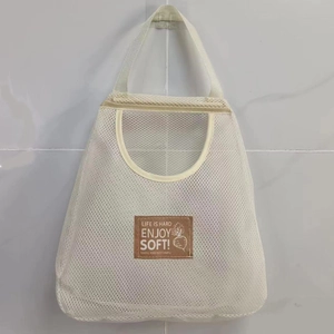 Wall-mounted off-white mesh storage bag for ginger and garlic with breathable polyester net