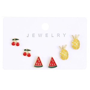 Detail of fruit earring set with cherry, watermelon and pineapple on jewelry card