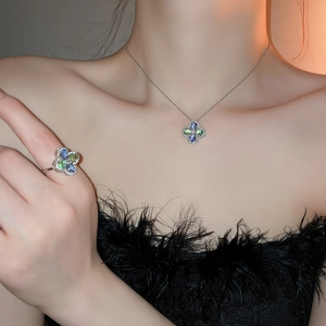 Luxurious silver necklace and ring set with blue and green zircon flower petal design