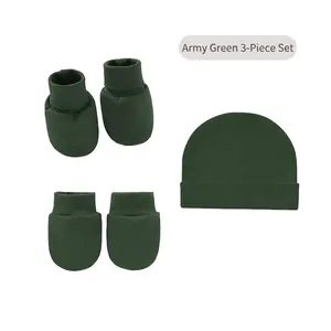 Three-piece army green knitted baby set including a beanie, mittens, and booties