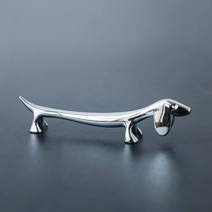Polished silver dachshund metal chopstick rest and elegant cutlery holder for table décor