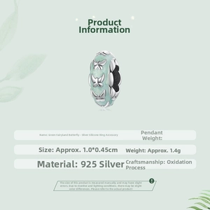 Detail showing a 925 silver butterfly charm with green enamel and 1.0x0.45cm dimensions