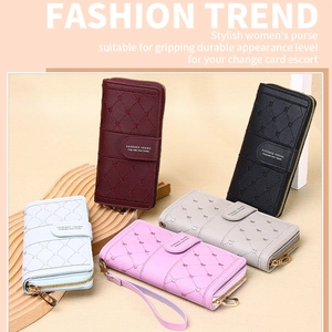 Detailed view of long quilted PU leather wallets in five colors with wrist straps