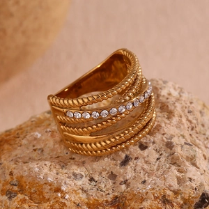 Detailed macro of 18K gold plated multi-layer woven ring with small white crystals