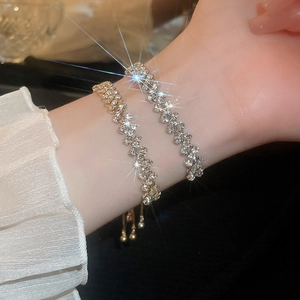Close-up of double-layered silver rhinestone bracelet with geometric sparkling Z-pattern