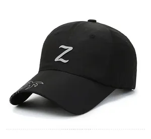 Detail of black quick-dry mesh cap featuring silver Z logo and embroidered side design