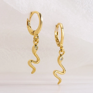 Minimalist 18K gold plated snake drop earrings with sparkling small stones on white mesh