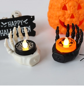 Halloween skeletal hand LED candles with spider and pumpkin patterns for festive decor