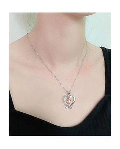 Detail of heart pendant with gold baby feet and I love you mom engraving