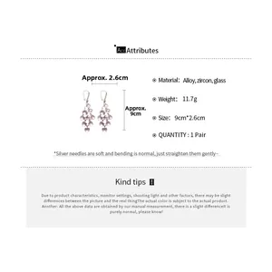 Detailed view showing dimensions and materials of long zircon heart tassel earrings