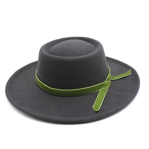 Detailed top view of dark grey wool felt fedora featuring a green velvet decorative band
