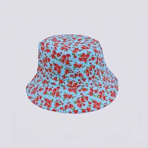 Detailed view of light blue bucket hat featuring red floral patterns on cotton canvas