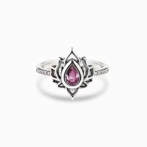 Vintage lotus ring with pear-cut pink stone and sparkling pavé crystals on a silver band