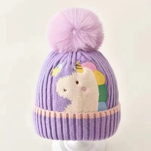 Purple unicorn knit baby hat with earflaps and fluffy pompom for toddlers winter warmth
