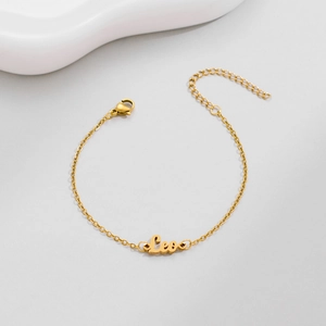 Detail of gold Leo zodiac bracelet with adjustable lobster clasp and extension chain