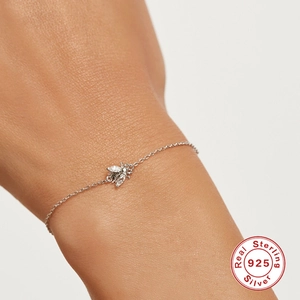 Elegant S925 sterling silver chain bracelet with a sparkling crystal bee charm on wrist